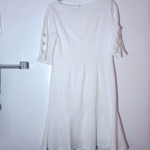 Dress, white with bottom ruffle and pearls sleeves size 10 made by Shelby Palmer
